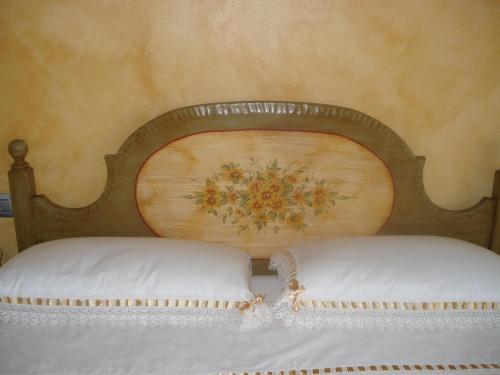 Cama o camas de una habitación en B&B I fiori di Marianna
