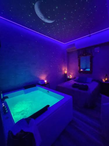 a purple room with a pool table in it at Tecaia Secret Luxury Suite in Formia
