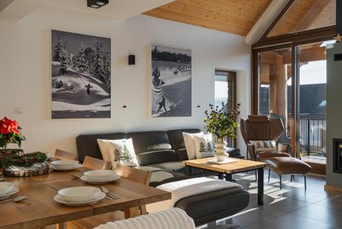 a living room with a couch and a table at APARTAMENT No 1 MOUNTAIN VIEW Sauna Priv okolice Zakopane Czorsztyn Kluszkowce in Kluszkowce