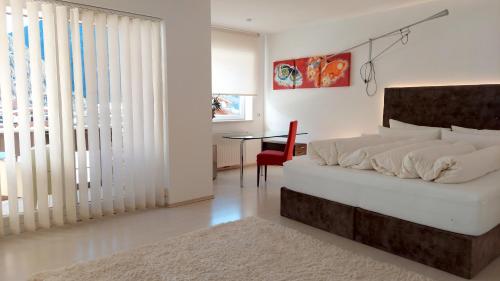 En eller flere senge i et værelse på Royal Appartements Sölden