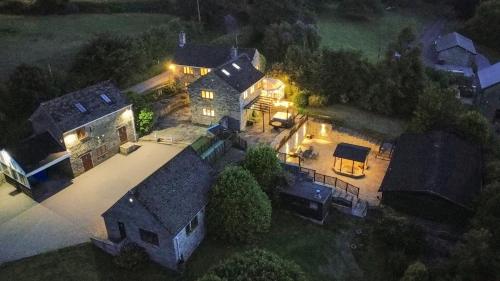 an overhead view of a large house with lights at Habberjam Farm - Swimming pool, Hot Tub, Sauna, Games Room in Sheffield