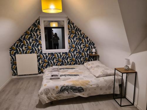 En eller flere senge i et værelse på Maison avec grand jardin clos