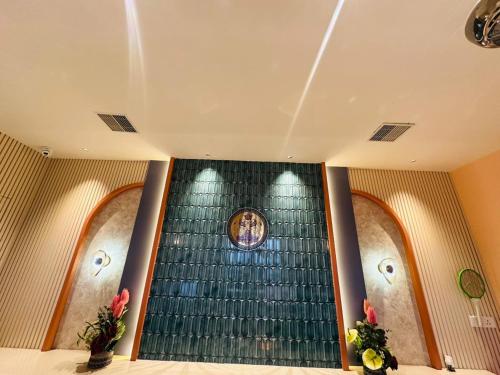 an escalator in a building with a picture on the wall at The Sterling Resort in Bhawānīgarh