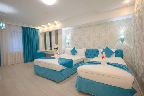 En eller flere senge i et værelse på Old Town Boutique Hotel