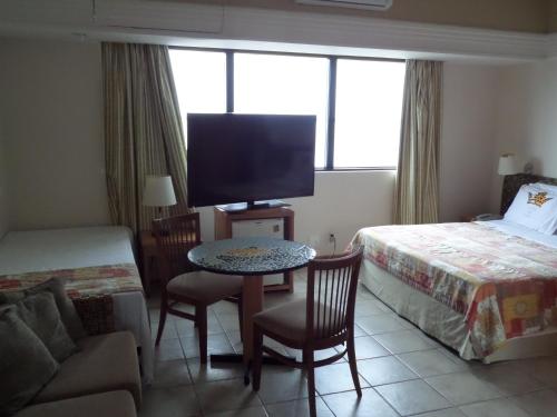 Cama o camas de una habitación en Flat para Temporada em Manaus