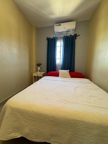 En eller flere senge i et værelse på Cielo Alto