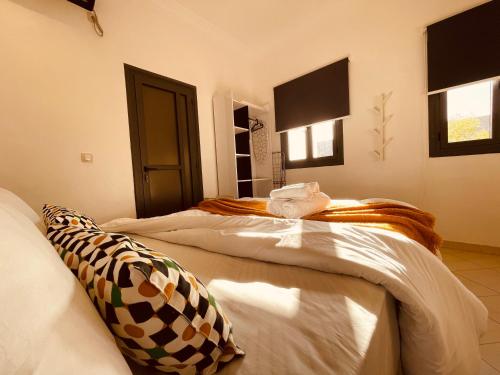 a bedroom with two beds in a room at ZyonFamily in Ouarzazate