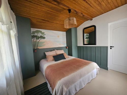 En eller flere senge i et værelse på Maison de charme au Canon