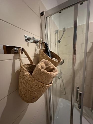a basket on the wall of a shower in a bathroom at Chata pri lese,Liptov in Bobrovec