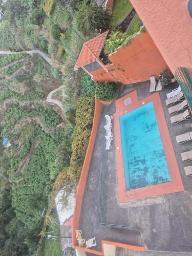 an overhead view of a swimming pool at a resort at Por Do Sol in Calheta