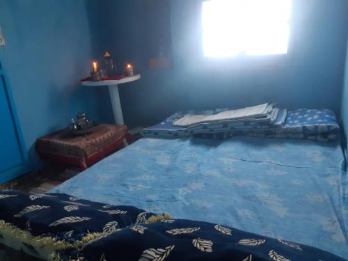 Postel nebo postele na pokoji v ubytování La grotte Moulay Atlantique d'Aglou