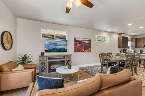a living room with a couch and a fireplace at Serene Escape - Central to Grand Canyon and Sedona! in Flagstaff