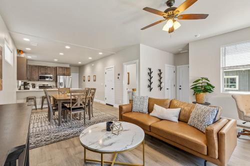 a living room with a couch and a table at Serene Escape - Central to Grand Canyon and Sedona! in Flagstaff