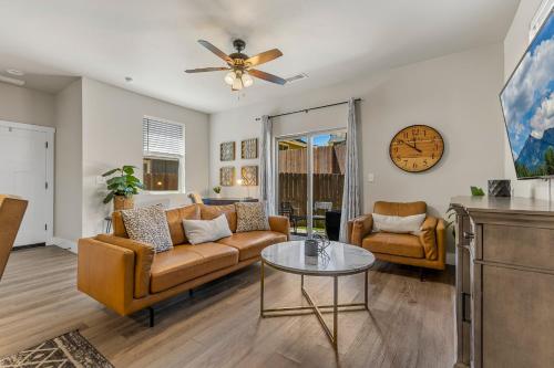 a living room with a couch and a table at Serene Escape - Central to Grand Canyon and Sedona! in Flagstaff