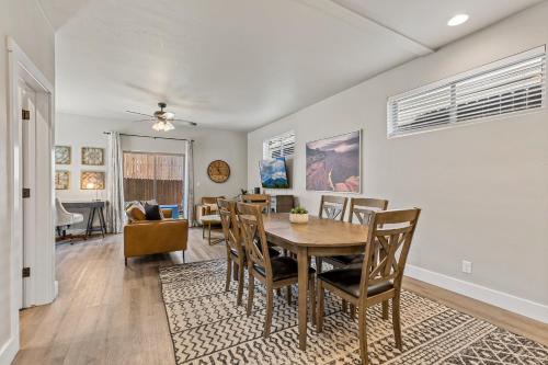 a dining room and living room with a table and chairs at Serene Escape - Central to Grand Canyon and Sedona! in Flagstaff