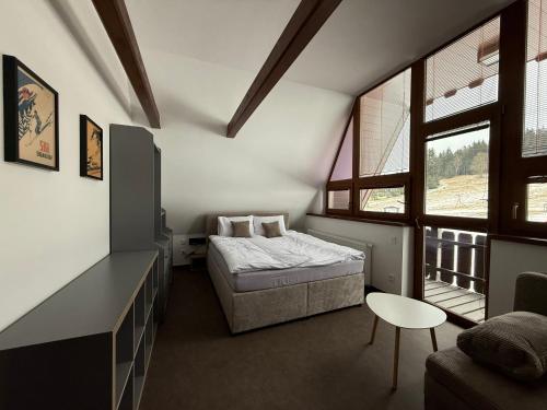 Postel nebo postele na pokoji v ubytování Arnika Hrabětice