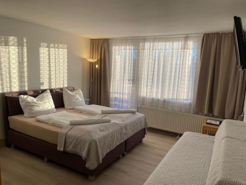 Postel nebo postele na pokoji v ubytování Ferienapartment TESLA im Wellnesshotel - Bayerischer Wald