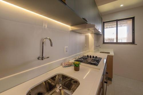 Kuchyň nebo kuchyňský kout v ubytování Pé na Areia com conforto | Vog Marine Ilhéus