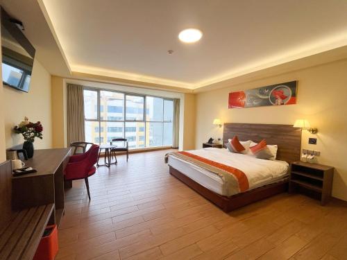 En eller flere senge i et værelse på SM HOTEL Plus