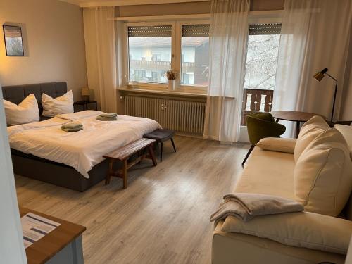 En eller flere senge i et værelse på 4-Bett-Appartement am Golfplatz