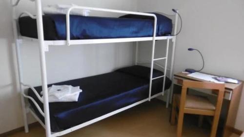 En eller flere senge i et værelse på Casa Per Ferie Arta Terme