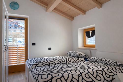 Giường trong phòng chung tại Appartamento Mary - Casa Green - Dog friendly, box auto