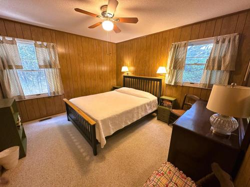 a bedroom with a bed and a ceiling fan at SS303- Duck Hill in Southern Shores