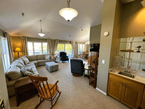a living room with a couch and a table at KH101 - Shells in Kitty Hawk