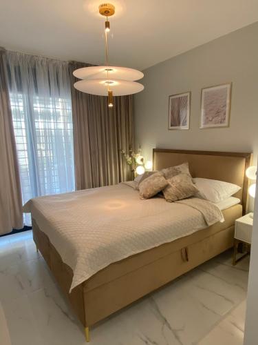 En eller flere senge i et værelse på Flamenca Village- Apartment Fabiola