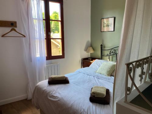 En eller flere senge i et værelse på La Petite Maison à Beaulieu