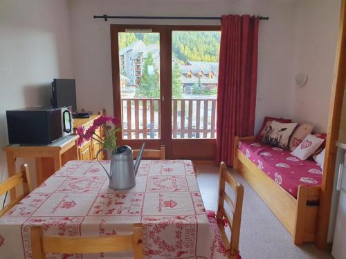 En eller flere senge i et værelse på Chez Angie et Fanny - Résidence l'Horizon Blanc