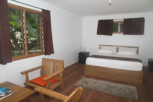 Postel nebo postele na pokoji v ubytování Evis Resort at Nggatirana Island