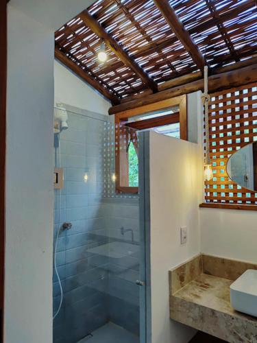 a bathroom with a shower and a sink and a toilet at Casa Miava - Studio 1 in Marau