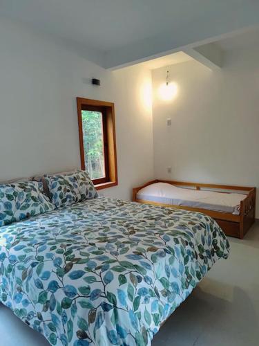 a small bedroom with a bed and a window at Casa Miava - Studio 1 in Marau