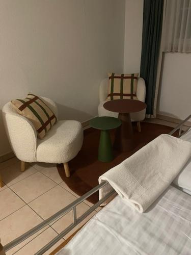 En eller flere senge i et værelse på Haus Alpenschloss