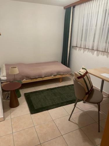 En eller flere senge i et værelse på Haus Alpenschloss