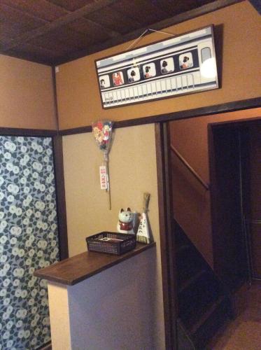 a hotel room with a sign on the wall at Hanakiya in Kyoto