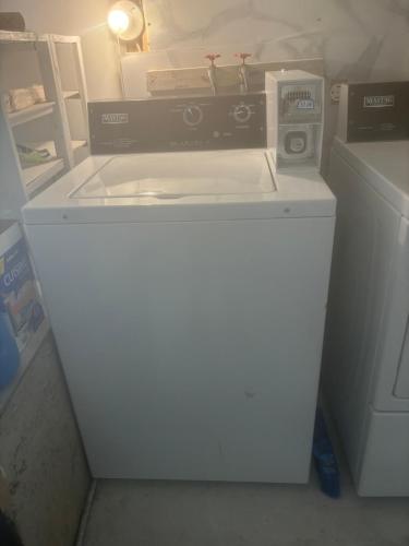 a white washer and dryer in a room with at park inn in Toronto