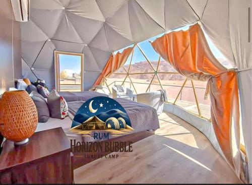 a room with a bed in a tent at RAM HORlZON BUBBLE LUXURY CAMP in Wadi Rum