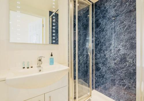 a bathroom with a sink and a shower at Riverlight Studio sleep 3 in Cambridge
