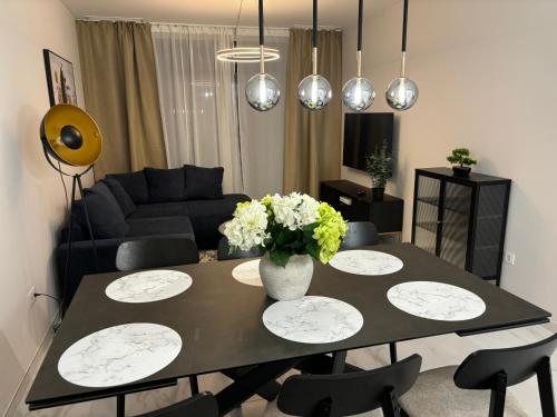 a living room with a table with flowers on it at Flamenca Village- Apartment 459 in Orihuela Costa