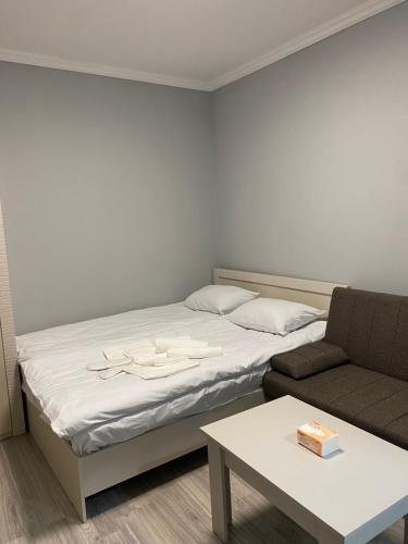 เตียงในห้องที่ Elite Guesthouse
