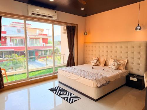 En eller flere senge i et værelse på The Grand Haven Vista