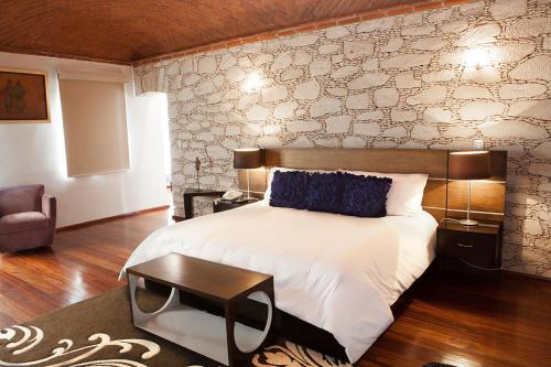 En eller flere senge i et værelse på Casa Diamante Hotel Boutique - Mineral de Pozos