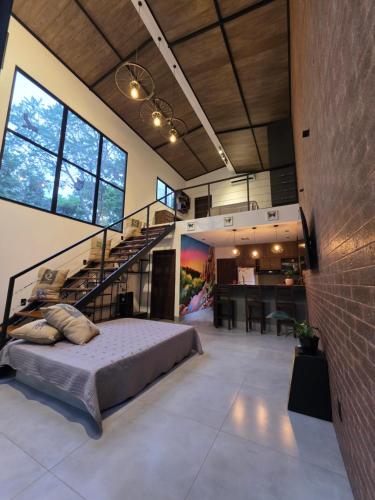 En eller flere senge i et værelse på CT Vila Raiza Goulão