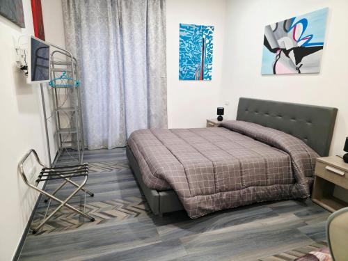 a bedroom with a bed and a ladder in it at Casa Vacanze 21 Ventuno in Antrodoco