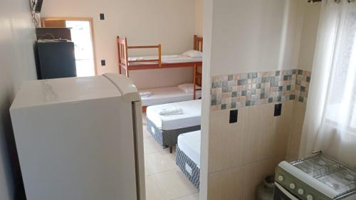 Postel nebo postele na pokoji v ubytování Raízes Hotel