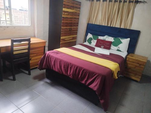 En eller flere senge i et værelse på J & J Paradise Guest House