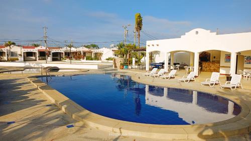 a swimming pool in the middle of a town at Riveri Salinas V53 in Salinas