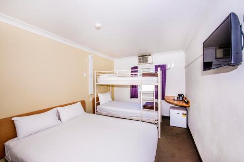 Tempat tidur dalam kamar di ibis Budget - Dubbo